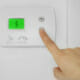 programmable thermostat to lower heat pump operating costs